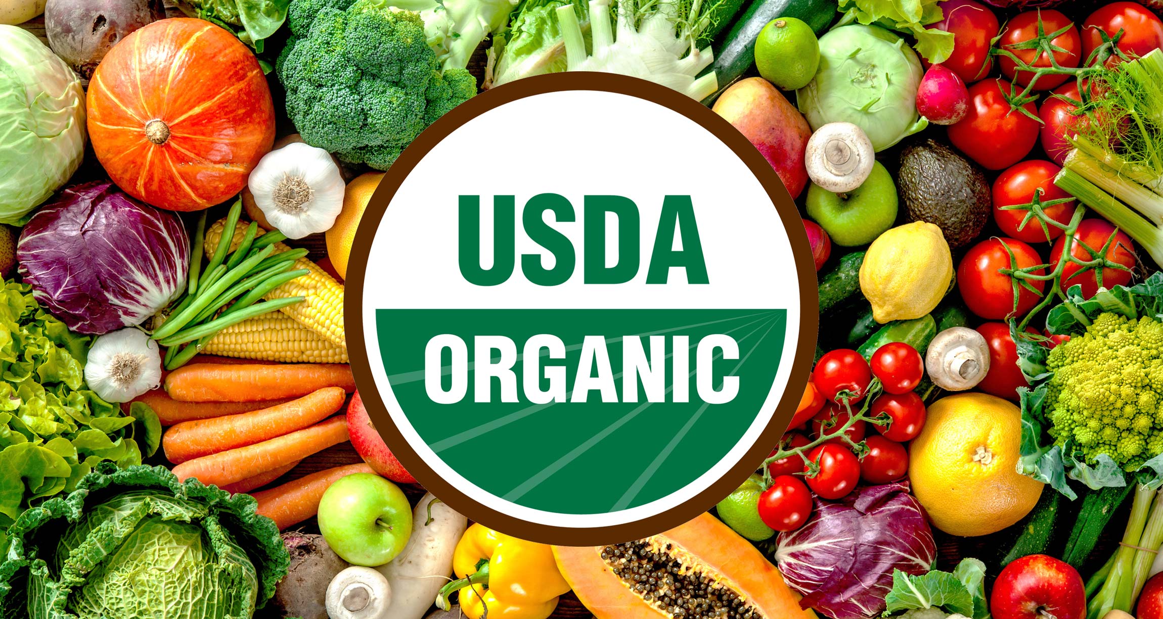  A variety of fruits and vegetables with a USDA organic label in the center.
